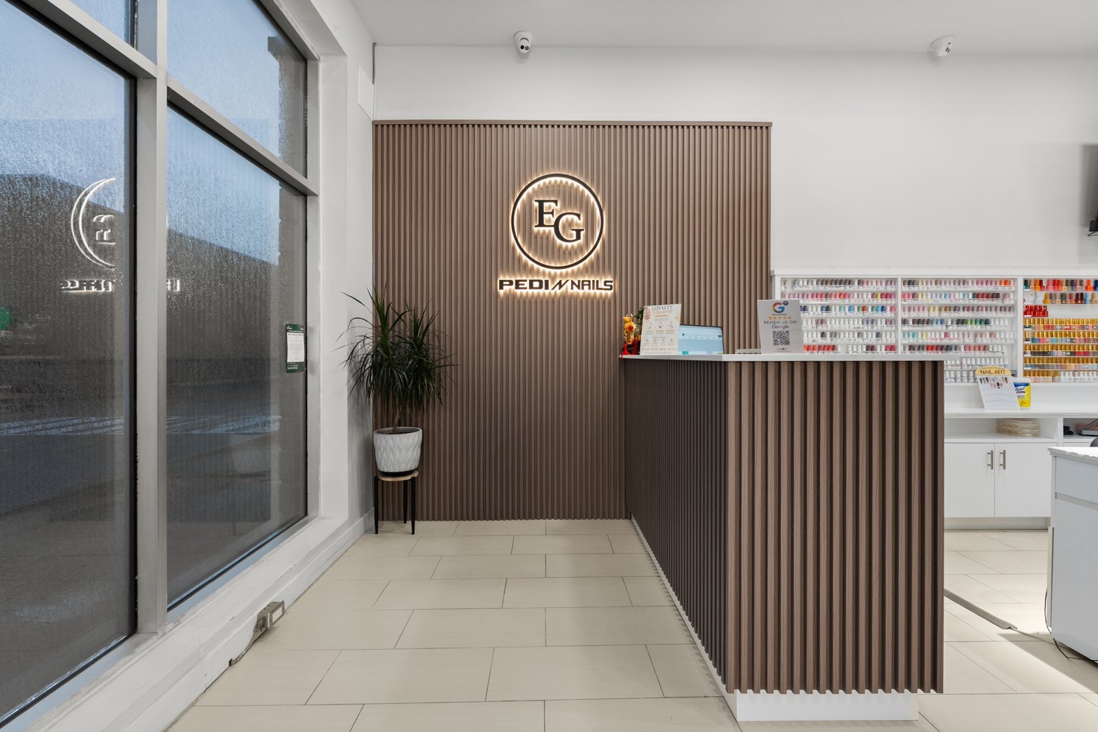 Pedi N Nails East Gwillimbury reception with illuminated EG logo
